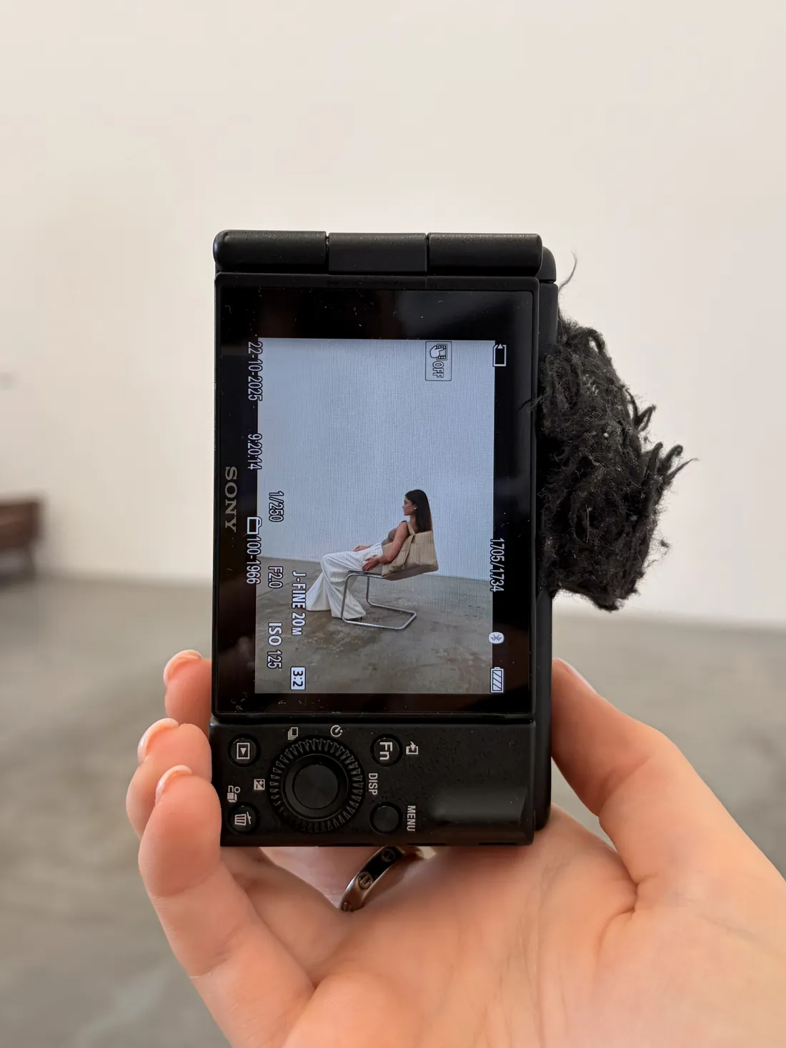 Reviewing a shot on camera during a brand content shoot